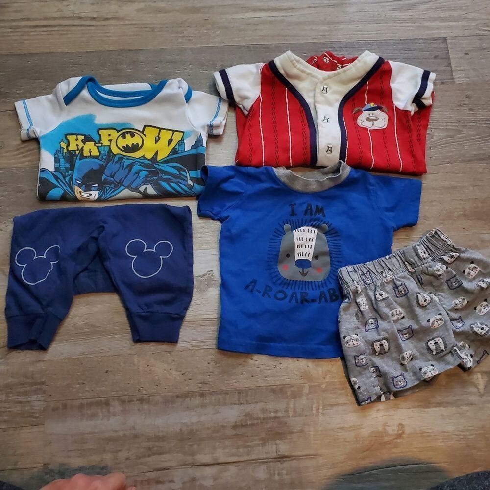 Assorted 0-3 month onesies and matching sets